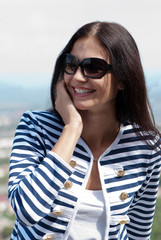 Closeup portrait of a smiling young beautiful woman talking on c