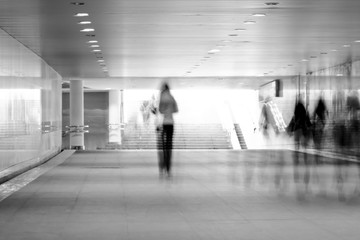 motion blurred of people walking in subway