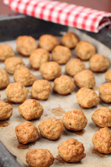 Roast meatballs on baking sheet. Shallow DOF