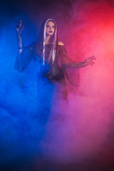 Gothic girl on smoke background