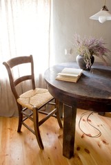 Fototapeta na wymiar Retro rural room in farmhouse with table and book