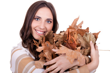 beautiful autumn woman holding  leaves