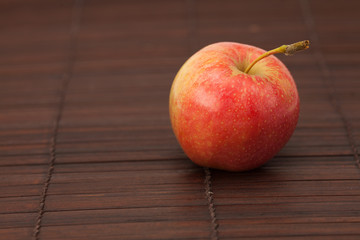 apple on a bamboo mat