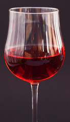 glass of wine on a black background