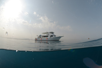 Fish eye view of a motor boat on a calm ocean