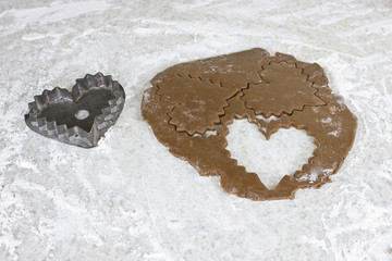 Preparing heart gingerbread cookies