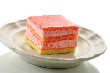 strawberry flavored layer cake on a plate