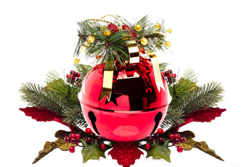 Shiny red jingle bell with a holly sprig isolated on white