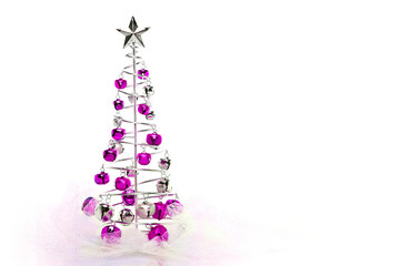 Christmas tree made out of pink and silver jingle bells