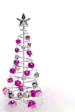 Christmas tree made out of pink and silver jingle bells