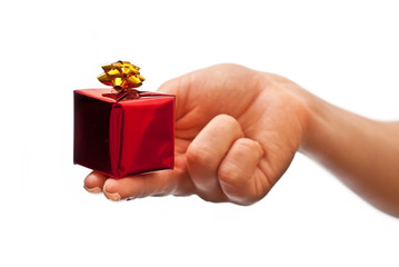 Red gift box in woman's hand
