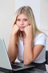 Bored businesswoman in front of computer