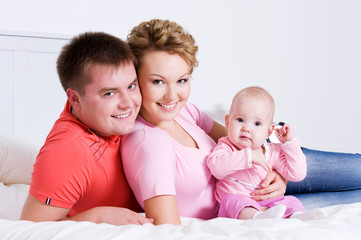 Young happy fun family with baby