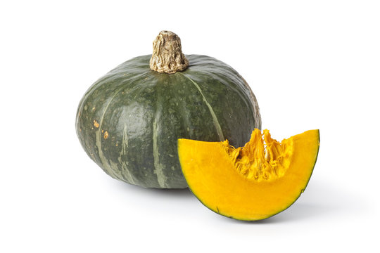 Whole green pumpkin with a slice