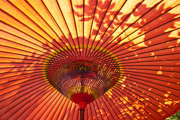 Closeup of a red Japanese parasol © Andrew Haddon