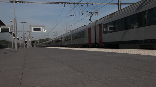 Train departs railway station