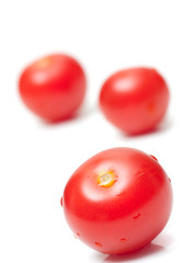 fresh tomatoes on white background