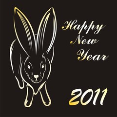 Simbol of 2011 year. gold rabbit on black background