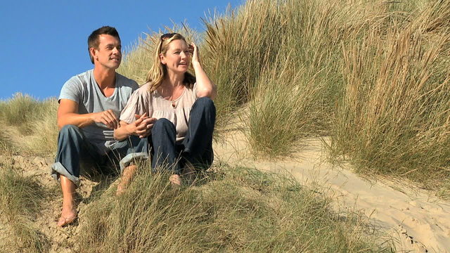 Couple Enjoying Being Close at the Beach filmed at 60FPS