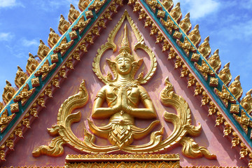 Buddhist art on gable of archway at Wat Kok Lam, Borabue