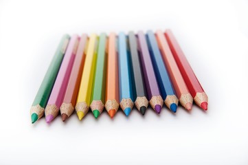 twelve sharpened colored pencils