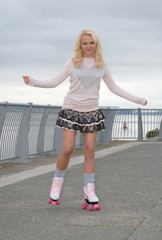 Pretty young woman on roller skates