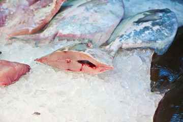 whole fresh fishes are offered in the fish market in asia