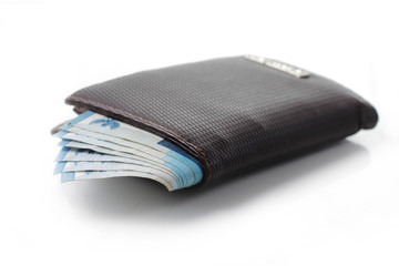 still life photo of wallet and money over white background