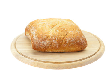 bread on a cutting board isolated on white