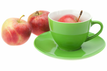 cup, saucer and apples isolated on white