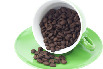 cup with coffee beans isolated on white