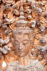 Thai art wood carving on door of temple