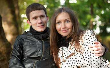 Fototapeta premium Young happy couple outdoors at fall