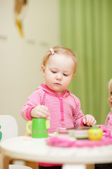 Little girl playing with toys