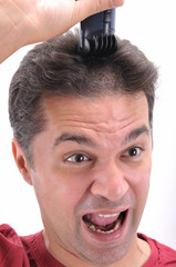 Obraz premium Barber cutting hair with clipper - a series of BARBER images.