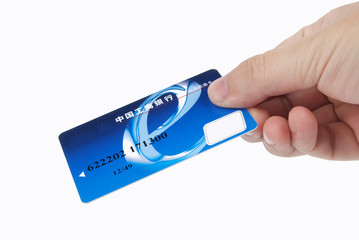 Credit card in hand on white background