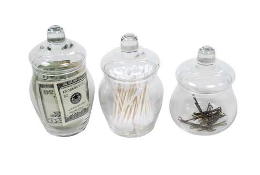 Apothecary Jars Filled With Money, Cleaners And Hair Clips