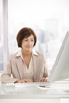 Senior businesswoman working on computer