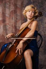 Woman in evening dress playing cello