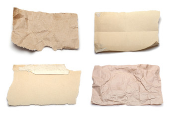 collection of various ripped pieces of paper on white background