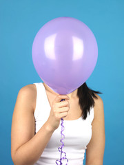 Young Woman Holding a Balloon. Model Released