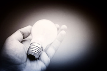 Background with lit lightbulb