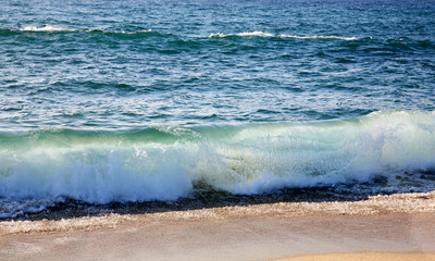 Waves on the beach in Sardinia, Italy.