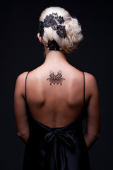 sexy woman with tattoo on her back