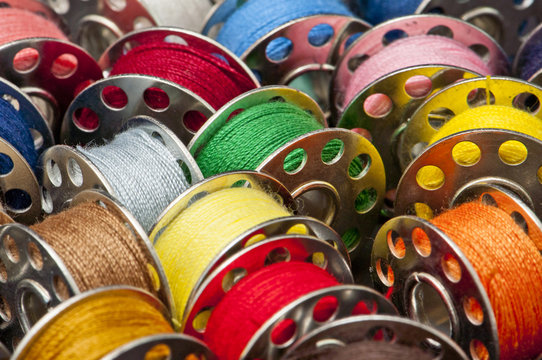 Colorful spools of yarn in a close-up