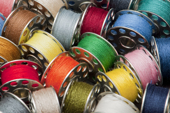 Colorful spools of yarn in a close-up