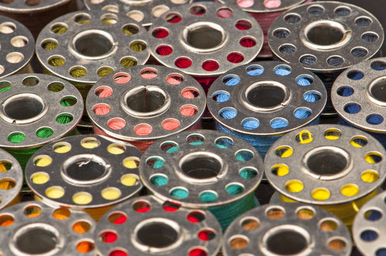 Colorful spools of yarn in a close-up