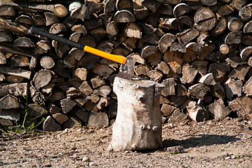 Axe used for chopping firewood with blade in chopping block2