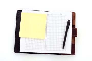 Notebook and pen isolated on white