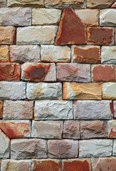 irregular shapes of modern stone brick wall, vertical